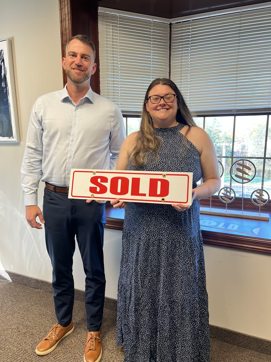Andrew Malm with a client on closing day
