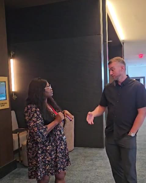 Andrew in conversation at an investor event