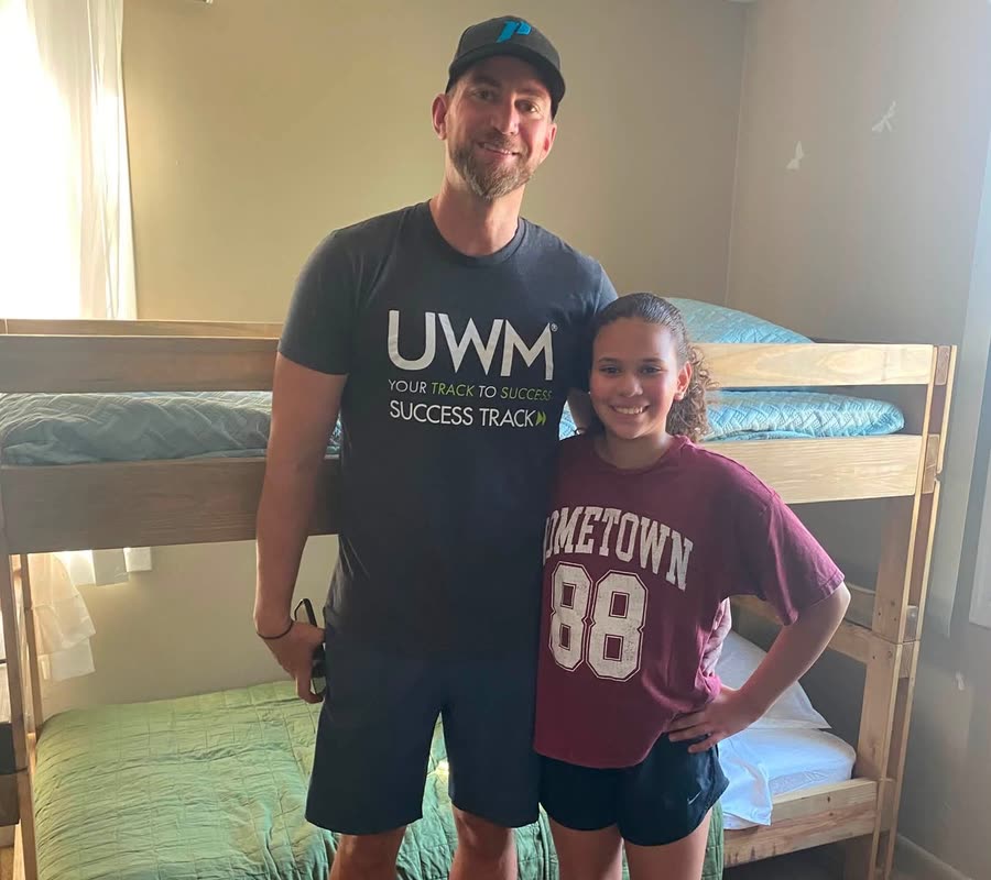 Andrew Malm and his daughter in front of a finished bunk bed